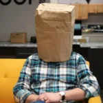 a person with a paper bag over their head